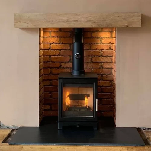 a fireplace with a wood burning stove