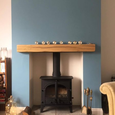 a fireplace with a wood mantle